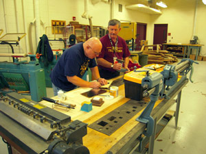 Setting up the metal shop.