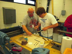 Soldering inside cylinder.