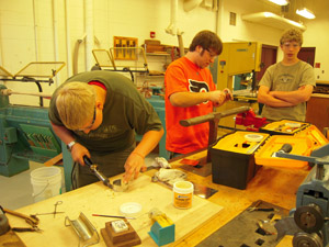 Soldering tank bottom to base.