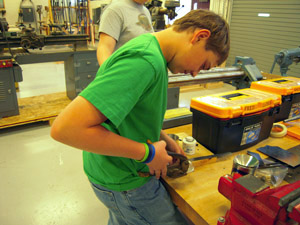 Punching hole for tank filler cap.