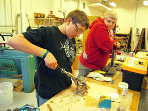 Soldering lantern bottom to inside cylinder.