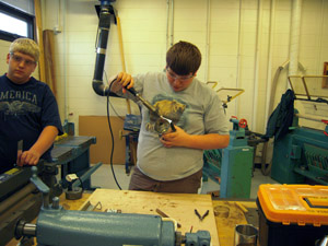 Soldering handle bracket to cylinder.