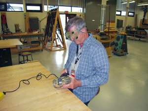 Sanding solder joints.