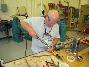 Soldering lens in lens cylinder.